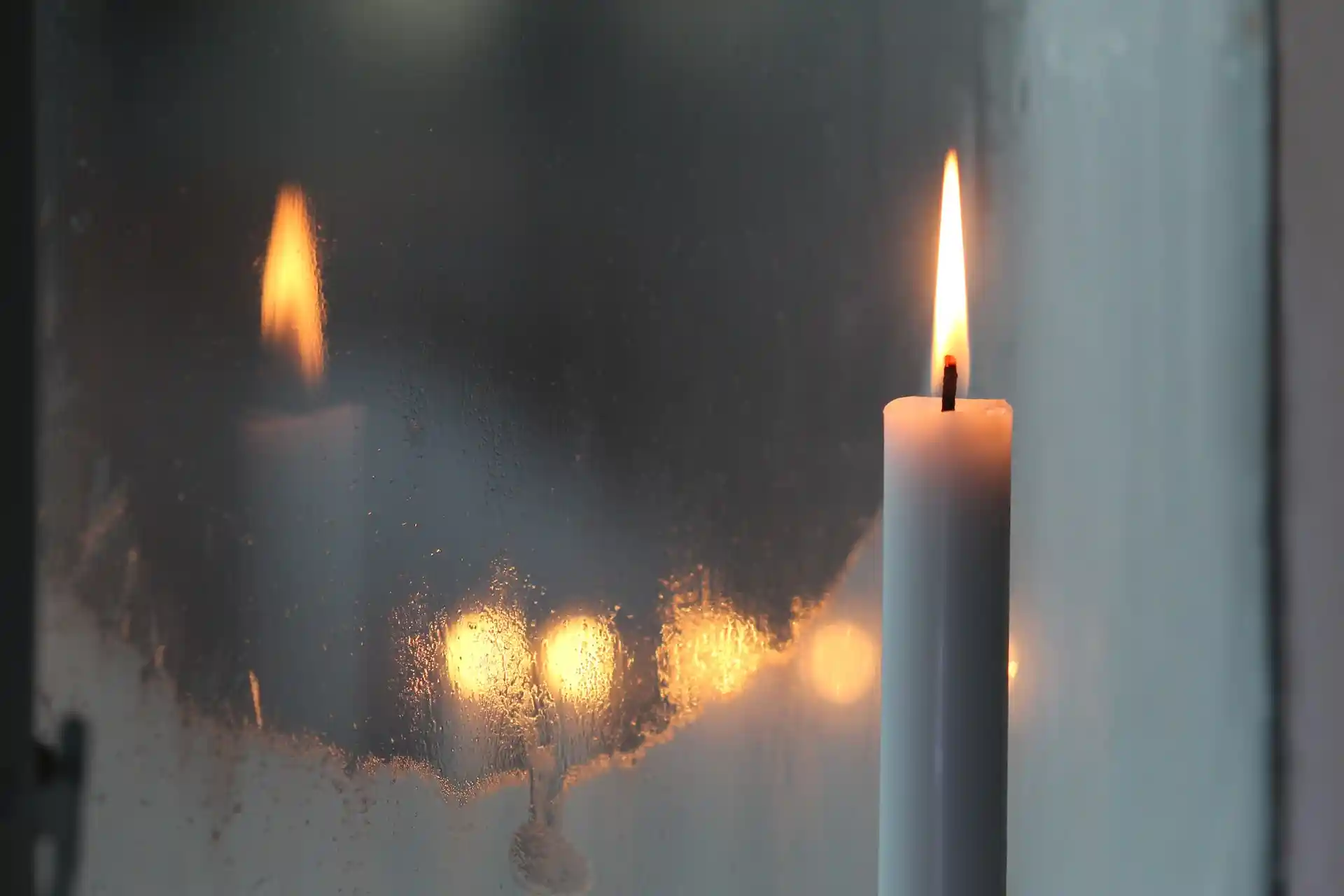 lit candles on window cill