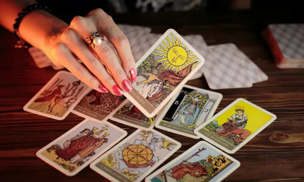 holding a tarot card