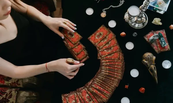 woman spreading tarot cards